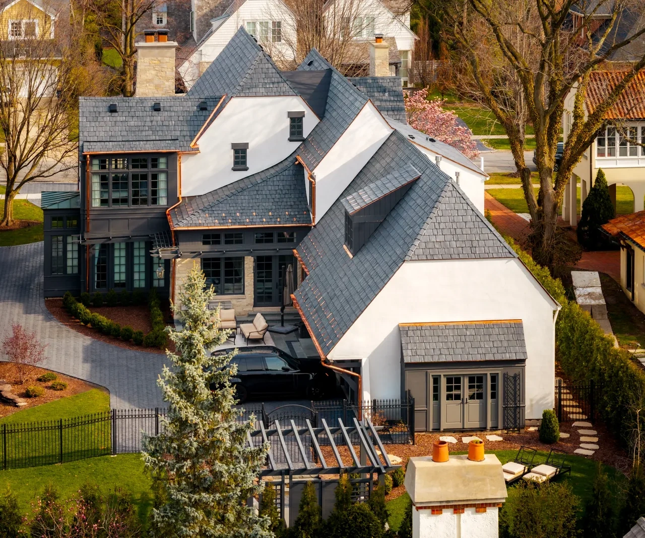 Completed Hinsdale residence with Brava slate roofing, copper gutters, and copper roof details