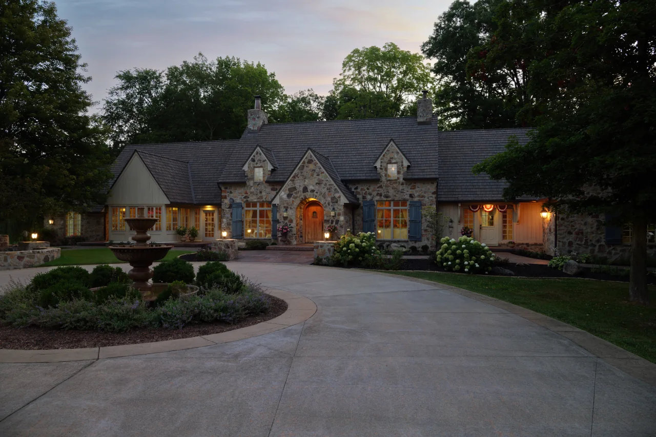 Completed Zionsville home at twilight with Brava cedar roofing